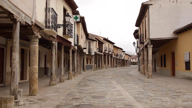 View of the main street of the Village of Ampudia in Palencia. Spain, with its characteristic arcades with columns