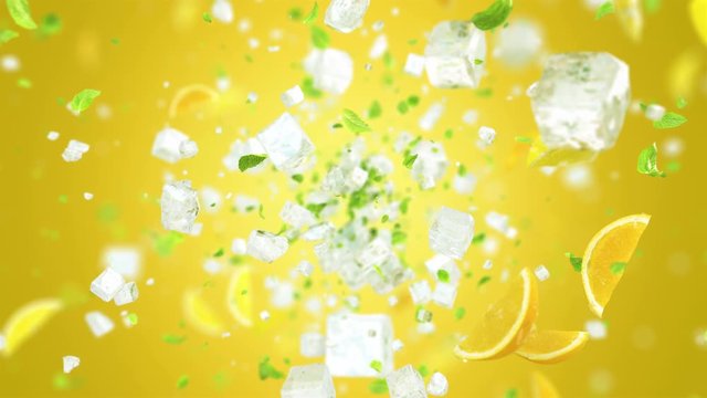 Exploding frosted ice cube with fruits and leafs in 4K