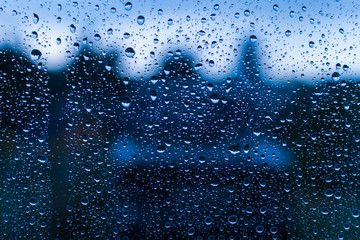 Naklejka na ściany i meble raindrops on the window glass close-up