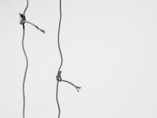 rope with shadow on the wall minimalism style, black and white