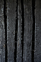 wall charred boards after fire