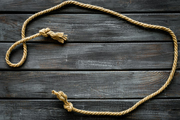 rope frame on wooden background top view mock up