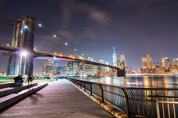 Brooklyn Bridge at night with Manhattan in the background