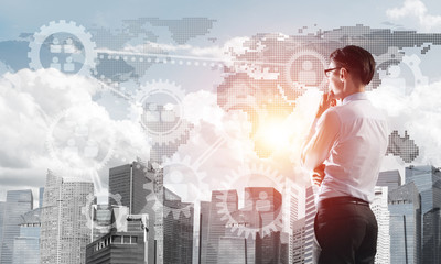 Concept of business success and control with confident boss against cityscape background