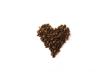 Heart made of coffee beans isolated on white