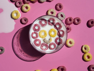 Happy face made with yellow and pink fruit loops