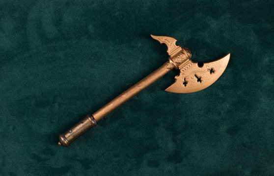 medieval poleax on a green background
