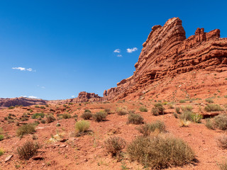 Fototapeta premium Low angle landscape of orange stone buttes in Valley of the Gods in Utah