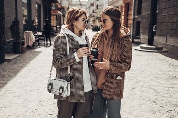 Portrait of Two Fashion Girls, Best Friends Outdoors, Coffee Break Lunch