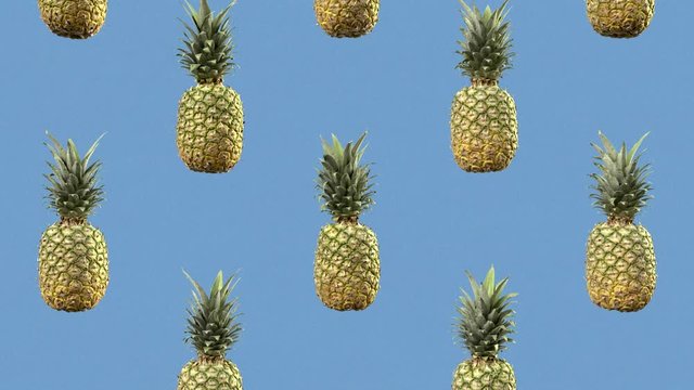 Sweet pineapples are slowly falling. Looped animation. Motion background