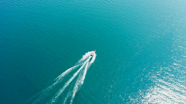 Aerial video with drone, the movement of boats on the water, Lake Garda, Italy.