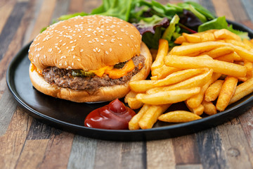 Cheese burger - American cheese burger with Golden French fries