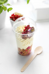 Yogurt with whipped cream, fruit and granola. Dietetic catering.