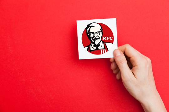 KFC logo seen displayed on smart phone screen with Macdonald logo visible  blurred in the background Stock Photo - Alamy