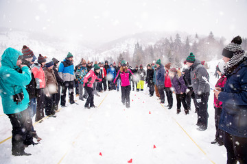 group of young people having blindfolded games competition