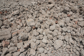 Close-up of gravel grunge background left after concrete building demolition