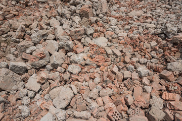 Close-up of gravel grunge background left after concrete building demolition