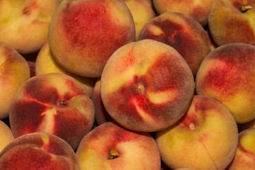 Peach Background. Texture background of sweet red ripe peaches. Ripe peaches close-up.