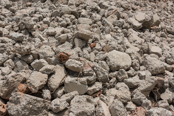 Close-up of gravel grunge background left after concrete building demolition