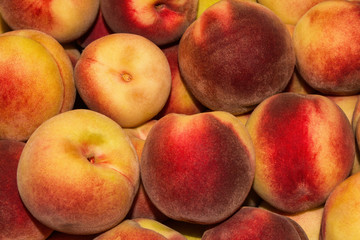 Peach Background. Texture background of sweet red ripe peaches. Ripe peaches close-up.