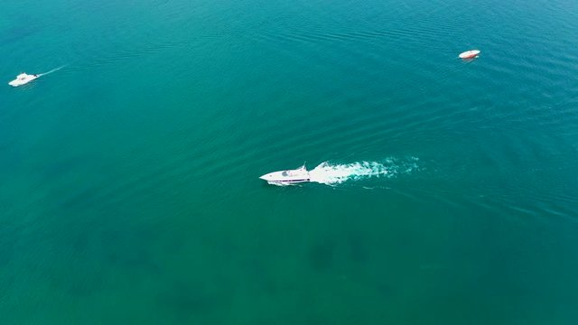 Aerial video with drone, the movement of boats on the water, Lake Garda, Italy.