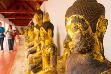golden buddha at Wat Phra Borommathat Chaiya in Chaiya, Surat Thani, Thailand.