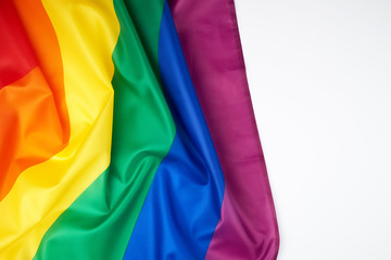textile rainbow flag with waves,  symbol of freedom of choice of lesbians