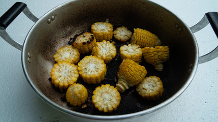 burned-out corn in  pot