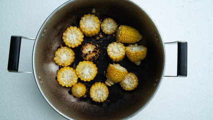 burned-out corn in  pot