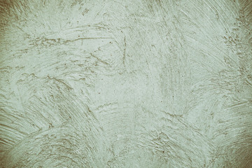 Cement wall have copy space for text. Gray green texture background. Beige plastered wall. Texture of grungy plaster wall.