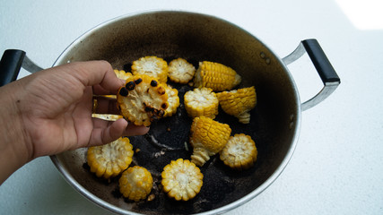 burned-out corn in  pot