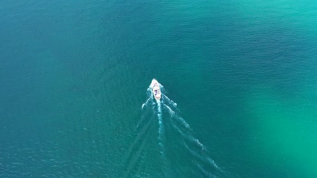 Aerial video with drone, the movement of boats on the water, Lake Garda, Italy.