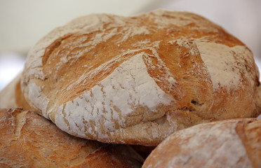 Loafs of traditional bread on stack close up