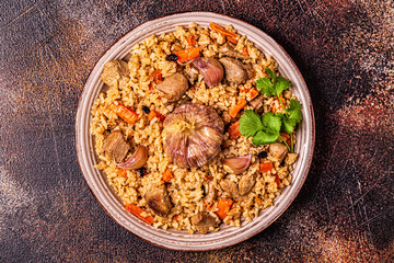 Pilaf with meat, vegetables and spices.