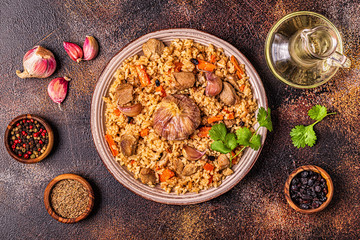 Pilaf with meat, vegetables and spices.