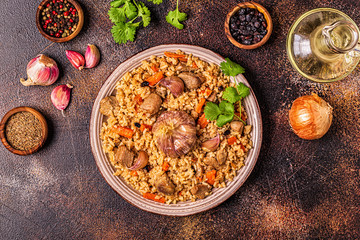 Pilaf with meat, vegetables and spices.