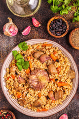 Pilaf with meat, vegetables and spices.