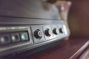 Fototapeta premium An old vinyl record player with wooden cases