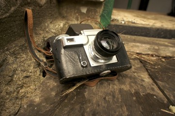 old vintage film camera and belt bag, retro camera and leather case