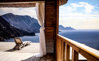 Wooden terrace and mountains landscape 