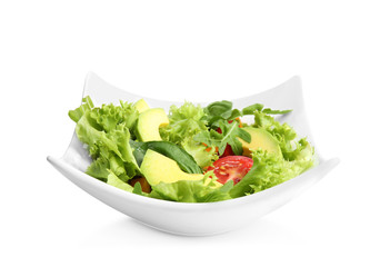 Delicious avocado salad in bowl on white background