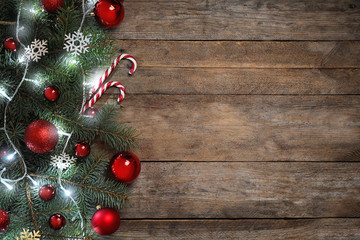 Christmas decoration on wooden background, flat lay. Space for text