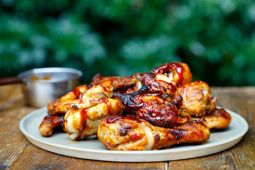 Barbecue chicken wings and drumsticks with sauce