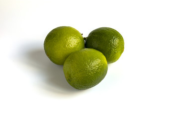 Lime Isolated. Whole Green lemon Citrus Fruit Set. Fresh Organic Limes for Citric Coclatil or Lemonade. Group of Raw Vegetarian Diet Lime. Clipping path on White Background. Juicy Vitamin Plant