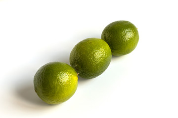 Green Lime Isolated Fruit Set. Whole lemon Citrus. Fresh Organic Limes for Citric Coclatil or Lemonade. Group of Raw Vegetarian Diet Lime. Clipping path on White Background. Juicy Vitamin Plant