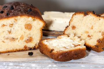 Fototapeta na wymiar Barmbrack or bairin breac is a traditional Irish sweet yeast bread with grapes and raisins, often eaten with afternoon tea butter and traditionally served on Halloween.