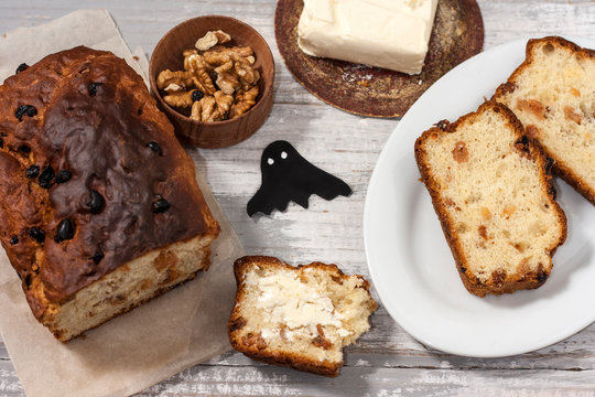 Barmbrack or bairin breac is a traditional Irish sweet yeast bread with grapes and raisins, often eaten with afternoon tea butter and traditionally served on Halloween.