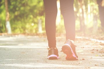 Healthy young woman exercising in sunny bright light. Sport exercise concept.