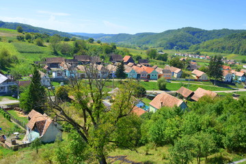 Typical rural landscape and peasant houses in  the village Alma Vii (Almen) Transylvania, Romania....