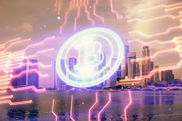 Multi exposure of cryptocurrency theme hologram drawing and city veiw background. Concept of blockchain and bitcoin.